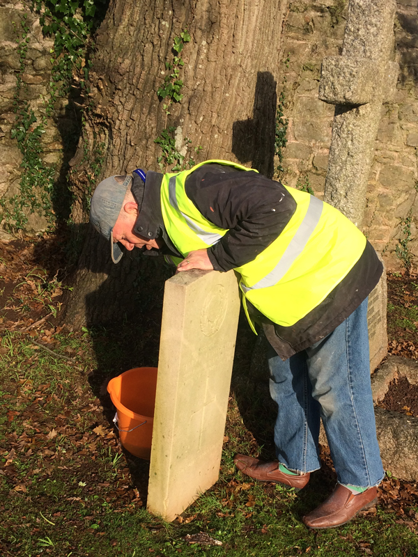Vane Hill ARBD care home resident cleaning war graves as part of a new 'Eyes On, Hands-On' project run by The CWGC