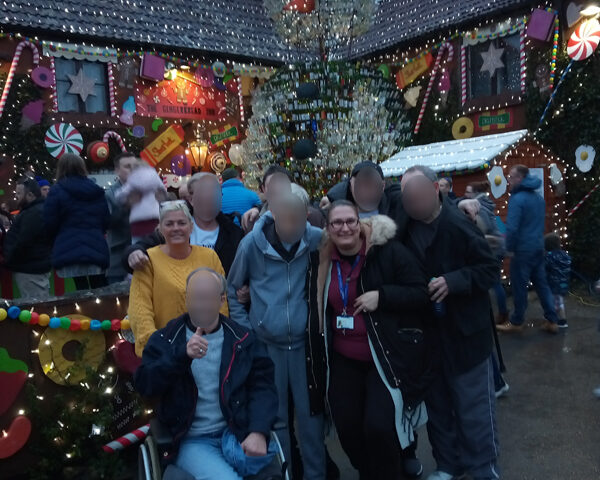 Serenita ARBD care home residents and staff outside the Gingerbread Inn, Priddy