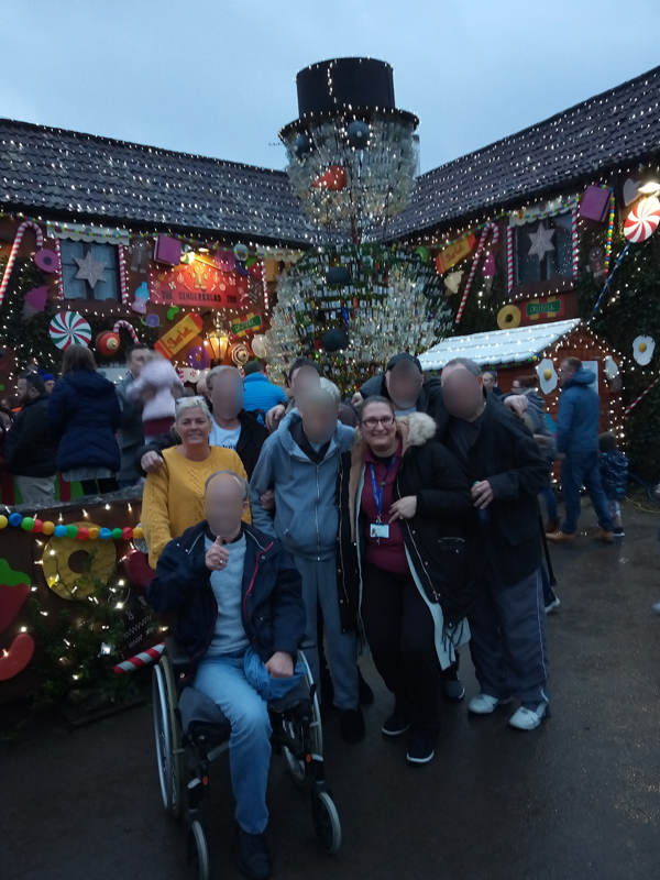 Serenita ARBD care home residents and staff outside the Gingerbread Inn, Priddy
