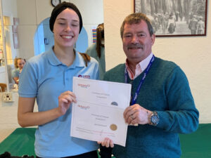 Cavan institute, Ireland, Nursing student, April, receving her training certificates from Steve, Vane Hill Care Home Manager